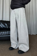 KREATE Asymmetric Button-Up Pleated Jeans